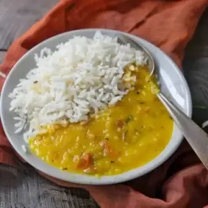 A bowl of white rice and lentil curry, a south Asian dish popular with the children attending Kiddisafe.